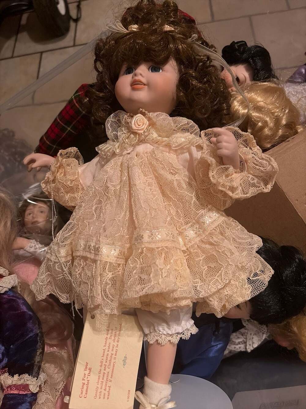 Camelot Handcrafted Porcelain Doll with Peach Lace Dress and Brown Curly Hair